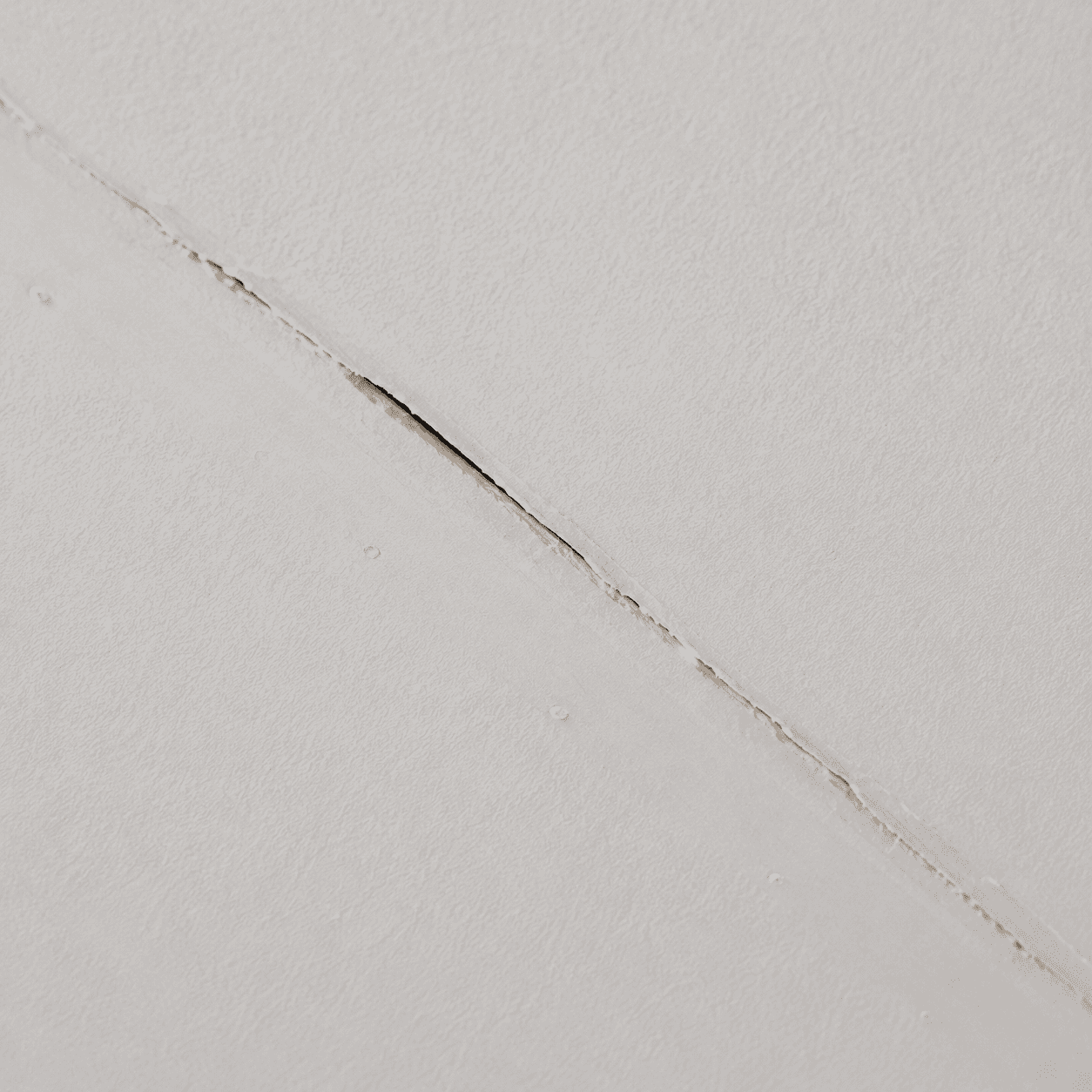 Crack and seam separation in a drywall ceiling