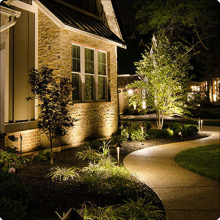 landscape lighting installation for pathways and garden features