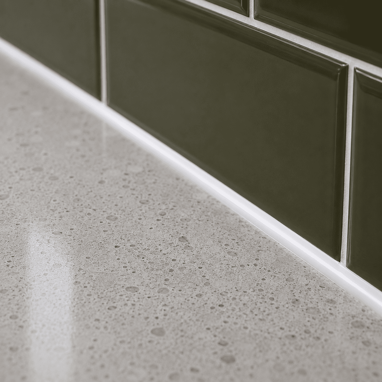 Kitchen caulking — sealed countertop, backsplash, and sink joints