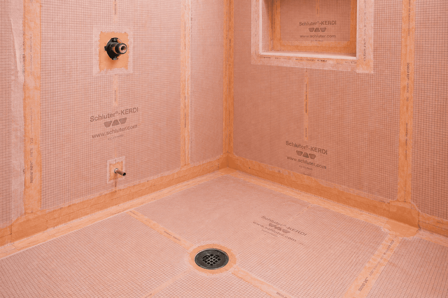 Schluter-KERDI waterproofing membrane and leveled substrate before tile in a Toronto bathroom